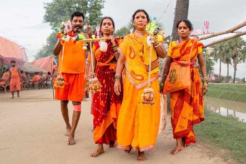 The connection between Water and Religion - Kanwarias carrying the holy Ganga water in 'kanwars' for offering to Lord Shiva in Bhagalpur district, Bihar